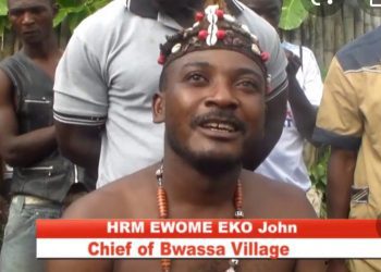 Chief of Bwassa village in the South West Region, cum soldiers, Moja Moja