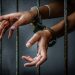 Prisoner in prison with handcuff