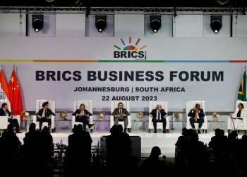 (From L to R) Wang Tongzhou, Chairman of China's Communications Construction Company, Onkar Kanwar, Chairman of BRICS Business Council of the India Chapter and Chairman of Apollo Tyres, Mikhail Makarov, Chair Deregulation WG and director of the Agency of Strategic Initiative Office of International Relations, Angelo Oselame, head of Middle East and Africa of Marcopolo, Stavros Nicolaou, BRICS Business Council of the SA Chapter, Wamkele Mene, secretary-general of the African Continental Free Trade Area (AfCFTA), and Gugulethu Mfuphi, Award-winning Financial Journalist, attend the 2023 BRICS Bisieness Forum at the Sandton Convention Centre in Johannesburg on August 22, 2023. (Photo by GIANLUIGI GUERCIA / AFP)