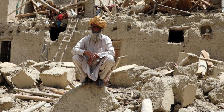 PAKTIKA, AFGHANISTAN - JUNE 22: A man is seen on debris of a building after the magnitude 6.1 quake shakes border provinces of Paktika, Afghanistan on June 22, 2022. The death toll from Tuesday's earthquake in Afghanistan has risen to 1,150, an official said. (Photo by Sayed Khodaiberdi Sadat/Anadolu Agency via Getty Images)