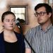 American couple Nicholas Spencer and his wife, Mackenzie Leigh Mathias Spencer, both 32, stand in the dock at Buganda road court, where they were charged with torturing a ten year old John Kayima and state prosecutor objected to their application saying that the two have been illegally in Uganda after their work permits expired, in Kampala, Uganda, December 14, 2022. REUTERS/Abubaker Lubowa