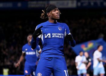 Madueke celebrates his winning penalty against Palace