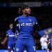 Madueke celebrates his winning penalty against Palace