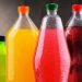 Plastic bottles of assorted carbonated soft drinks in variety of colors
