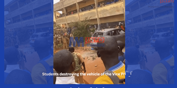 Students vandalising the vehicle of the VP
