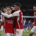 Arsenal's Belgian midfielder #19 Leandro Trossard (C) celebrates with teammates after scoring his team third goal during the English Premier League football match between Arsenal and Liverpool at the Emirates Stadium in London on February 4, 2024. (Photo by Ian Kington / IKIMAGES / AFP)