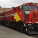 Sand truck collides with train, injuring two