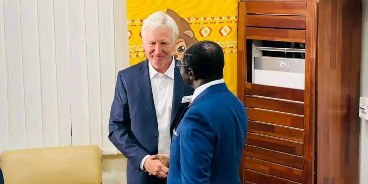 Indomitable Lions coach March Brys with the Minister of sports