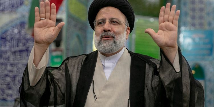 TEHRAN, IRAN - JUNE 18:  Ebrahim Raisi, a candidate in Iran's presidential elections waves to the media after casting his vote at a polling station on June 18, 2021, on the day of the Islamic republic's presidential election.  The country's incumbent president, Hassan Rouhani, is ineligible to run again after serving two terms in office. (Photo by Majid Saeedi/Getty Images)