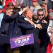 Republican presidential candidate former President Donald Trump is helped off the stage at a campaign event in Butler, Pa., Saturday, July 13, 2024. (AP Photo/Gene J. Puskar)