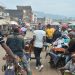 People walk at the food market in Bamenda on November 15, 2017, after a homemade bomb exploded overnight on November 12. Authorities in Cameroon have imposed a night-time curfew on November 8, 2017 and ordered the closure of shops and public places in the main city in a region rocked by unrest among the country's anglophone minority. Four makeshift bombs exploded overnight on November 12, a week after four soldiers were killed in the two administrative areas where most of Cameroon's anglophone minority live. Their deaths have been blamed by the authorities on 