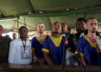 FILE PHOTO: Benjamin Zalman Polun, Marcel Malanga and Taylor Thompson, American citizens suspected, along with a group of over fifty other people, to be involved in an attempted coup in Congo, wait for the beginning of their trial in Kinshasa, Democratic Republic of Congo, June 7, 2024. REUTERS/Justin Makangara/File Photo