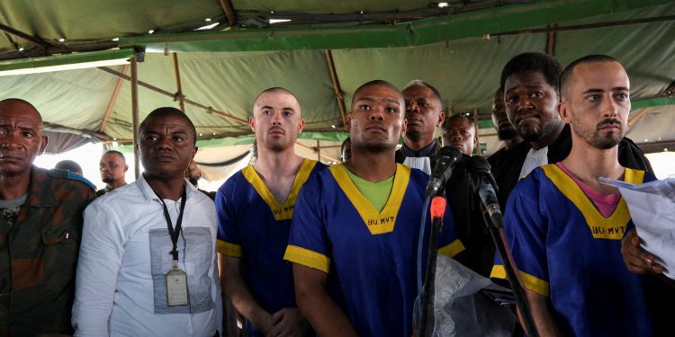 FILE PHOTO: Benjamin Zalman Polun, Marcel Malanga and Taylor Thompson, American citizens suspected, along with a group of over fifty other people, to be involved in an attempted coup in Congo, wait for the beginning of their trial in Kinshasa, Democratic Republic of Congo, June 7, 2024. REUTERS/Justin Makangara/File Photo