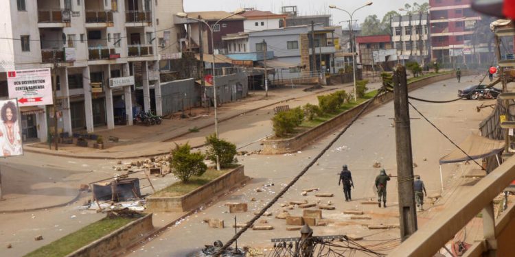 Soldiers clear a road in Bamenda, Cameroon, December 8, 2016. REUTERS/Stringer