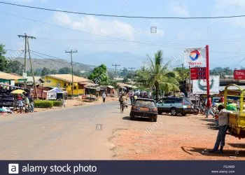 Main Street Of Ndop A Small Town In Cameroon With A Total Petrol Station F0JN69