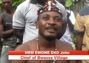 Chief of Bwassa village in the South West Region, cum soldiers, Moja Moja