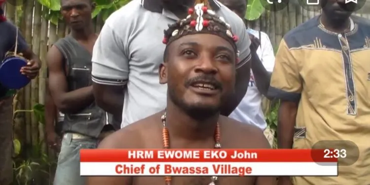 Chief of Bwassa village in the South West Region, cum soldiers, Moja Moja