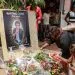 Mourners place a candles and flowers in the courtyard of Radio Amplitude FM, during a tribute ceremony for journalist Martinez Zogo, in the Elig Essono district of Yaounde on January 23, 2023. - A popular Cameroon radio journalist who had been missing following what a media rights group called an abduction has been found dead, his employer and police said on January 22, 2023.
Martinez Zogo was managing director of Yaounde-based private radio station Amplitude FM and the star host of a popular daily programme, Embouteillage (Gridlock).
On the air, the 51-year-old regularly tackled cases of corruption, not hesitating to question important personalities by name. (Photo by Daniel Beloumou Olomo / AFP)