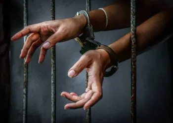 Prisoner in prison with handcuff
