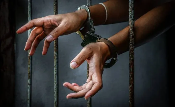 Prisoner in prison with handcuff