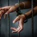 Prisoner in prison with handcuff