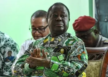 (FILES) Former Ivorian president and president of the Democratic Party of Cote d'Ivoire (PDCI) Henri Konan Bedie (c) applauds during the 7th session of the extraordinary congress of the PDCI-RDA at the party's headquarter in Abidjan on March 30, 2023. Former Ivory Coast president Henri Konan Bedie dies aged 89 announced the party in a statement on August 1, 2023.
 (Photo by Sia KAMBOU / AFP)