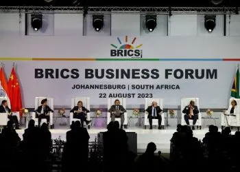 (From L to R) Wang Tongzhou, Chairman of China's Communications Construction Company, Onkar Kanwar, Chairman of BRICS Business Council of the India Chapter and Chairman of Apollo Tyres, Mikhail Makarov, Chair Deregulation WG and director of the Agency of Strategic Initiative Office of International Relations, Angelo Oselame, head of Middle East and Africa of Marcopolo, Stavros Nicolaou, BRICS Business Council of the SA Chapter, Wamkele Mene, secretary-general of the African Continental Free Trade Area (AfCFTA), and Gugulethu Mfuphi, Award-winning Financial Journalist, attend the 2023 BRICS Bisieness Forum at the Sandton Convention Centre in Johannesburg on August 22, 2023. (Photo by GIANLUIGI GUERCIA / AFP)