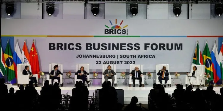 (From L to R) Wang Tongzhou, Chairman of China's Communications Construction Company, Onkar Kanwar, Chairman of BRICS Business Council of the India Chapter and Chairman of Apollo Tyres, Mikhail Makarov, Chair Deregulation WG and director of the Agency of Strategic Initiative Office of International Relations, Angelo Oselame, head of Middle East and Africa of Marcopolo, Stavros Nicolaou, BRICS Business Council of the SA Chapter, Wamkele Mene, secretary-general of the African Continental Free Trade Area (AfCFTA), and Gugulethu Mfuphi, Award-winning Financial Journalist, attend the 2023 BRICS Bisieness Forum at the Sandton Convention Centre in Johannesburg on August 22, 2023. (Photo by GIANLUIGI GUERCIA / AFP)