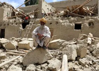 PAKTIKA, AFGHANISTAN - JUNE 22: A man is seen on debris of a building after the magnitude 6.1 quake shakes border provinces of Paktika, Afghanistan on June 22, 2022. The death toll from Tuesday's earthquake in Afghanistan has risen to 1,150, an official said. (Photo by Sayed Khodaiberdi Sadat/Anadolu Agency via Getty Images)