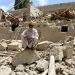 PAKTIKA, AFGHANISTAN - JUNE 22: A man is seen on debris of a building after the magnitude 6.1 quake shakes border provinces of Paktika, Afghanistan on June 22, 2022. The death toll from Tuesday's earthquake in Afghanistan has risen to 1,150, an official said. (Photo by Sayed Khodaiberdi Sadat/Anadolu Agency via Getty Images)