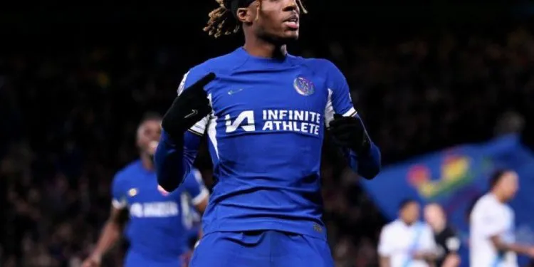 Madueke celebrates his winning penalty against Palace