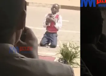 A child on his knees to call for peace in Cameroon