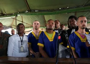 FILE PHOTO: Benjamin Zalman Polun, Marcel Malanga and Taylor Thompson, American citizens suspected, along with a group of over fifty other people, to be involved in an attempted coup in Congo, wait for the beginning of their trial in Kinshasa, Democratic Republic of Congo, June 7, 2024. REUTERS/Justin Makangara/File Photo