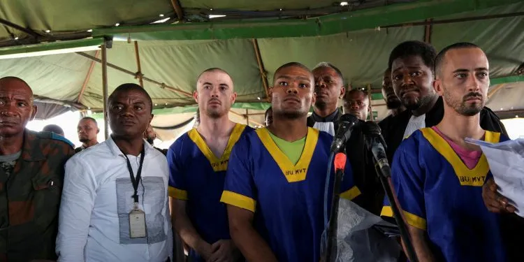FILE PHOTO: Benjamin Zalman Polun, Marcel Malanga and Taylor Thompson, American citizens suspected, along with a group of over fifty other people, to be involved in an attempted coup in Congo, wait for the beginning of their trial in Kinshasa, Democratic Republic of Congo, June 7, 2024. REUTERS/Justin Makangara/File Photo