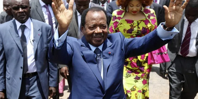 FILE - In this Sunday Oct 9, 2011 file photo, Cameroon President Paul Biya waves after casting his vote during the presidential elections in Yaounde, Cameroon. A bloody conflict between Cameroon's government and Anglophone separatists over language is now threatening next month's presidential election. The 85-year-old President Paul Biya, one of Africa's longest-serving leaders, vows to hold the largely Francophone country together even as thousands flee violence in English-speaking regions. (AP Photo/Sunday Alamba, File)