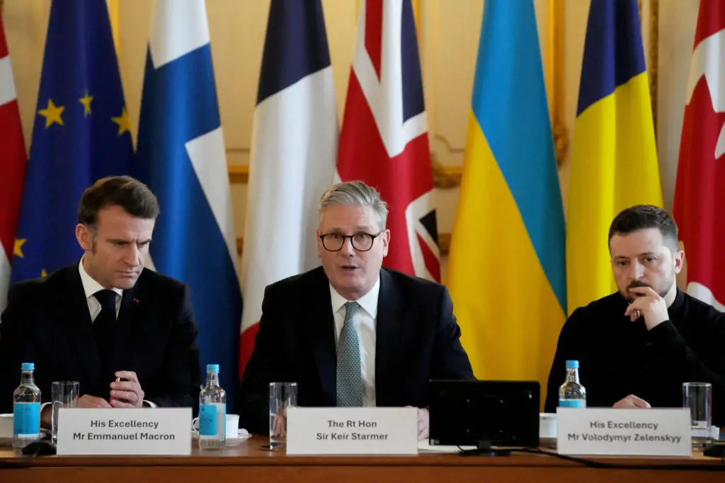 French President Emmanuel Macron, British Prime Minister Keir Starmer and Ukraine’s President Volodymyr Zelenskyy attend a meeting of leaders during a summit on Ukraine at Lancaster House in London, Britain, March 2, 2025. Christophe Ena/Pool via REUTERS